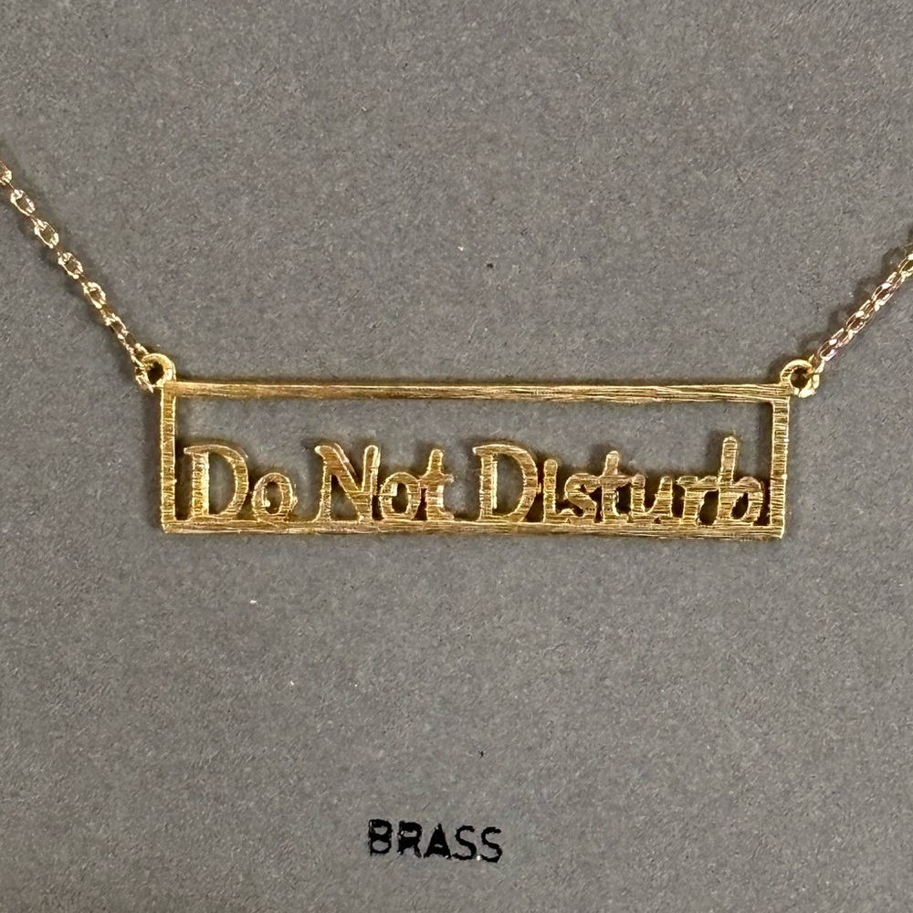 NWT gold tone Do Not Disturb nameplate-style necklace